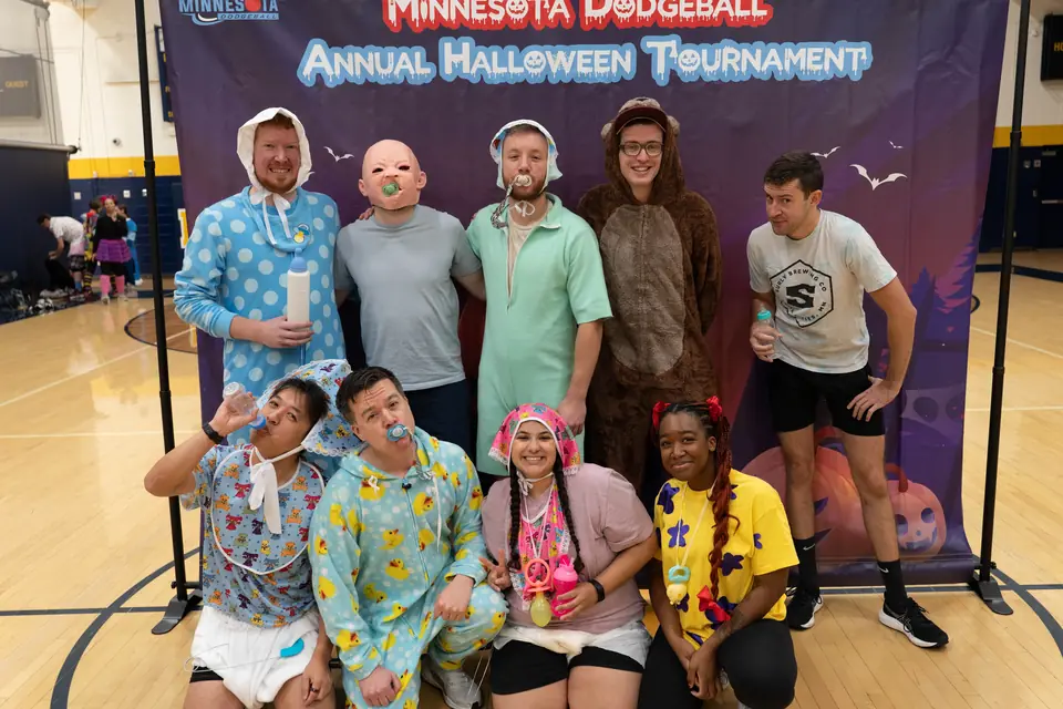 Halloween Tournament players together on the court
