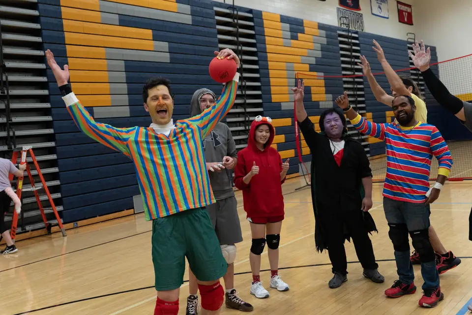 Halloween Tournament players together on the court