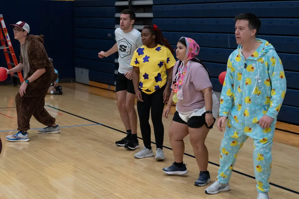 Halloween Tournament players together on the court