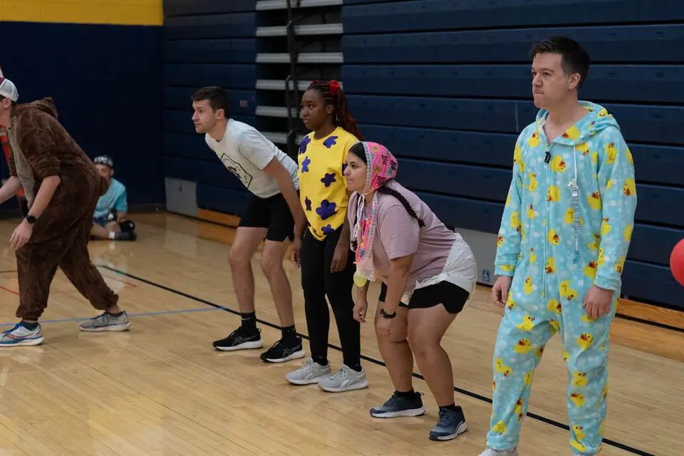 Halloween Tournament players together on the court